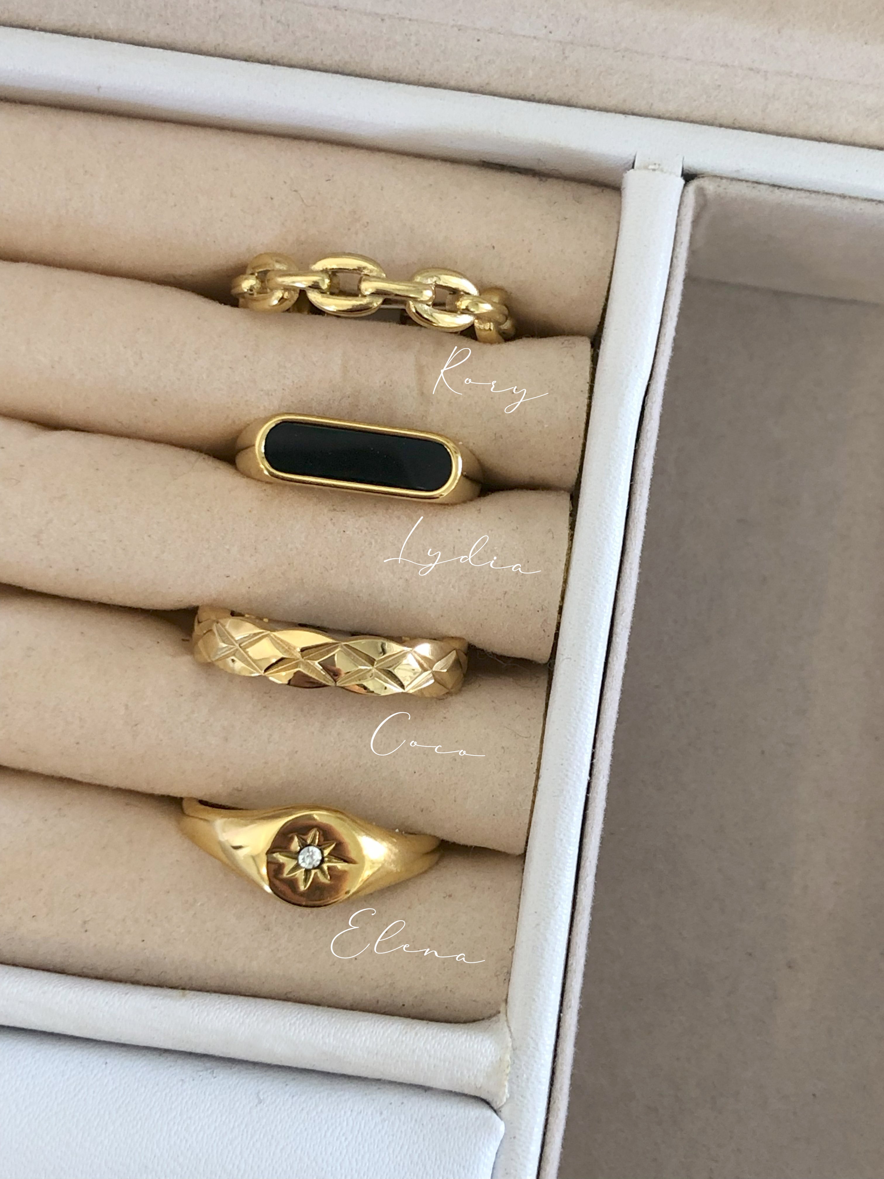 Lydia Black Onyx ring stacked in a jewelry box with other gold rings | myEdzy