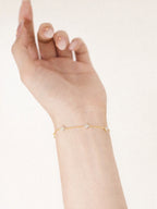 Evie 18K gold plated floral crystal bracelet on wrist by myEdzy