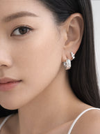Model styled with myEdzy Coco Quilted Hoops showing elegant and modern jewelry look