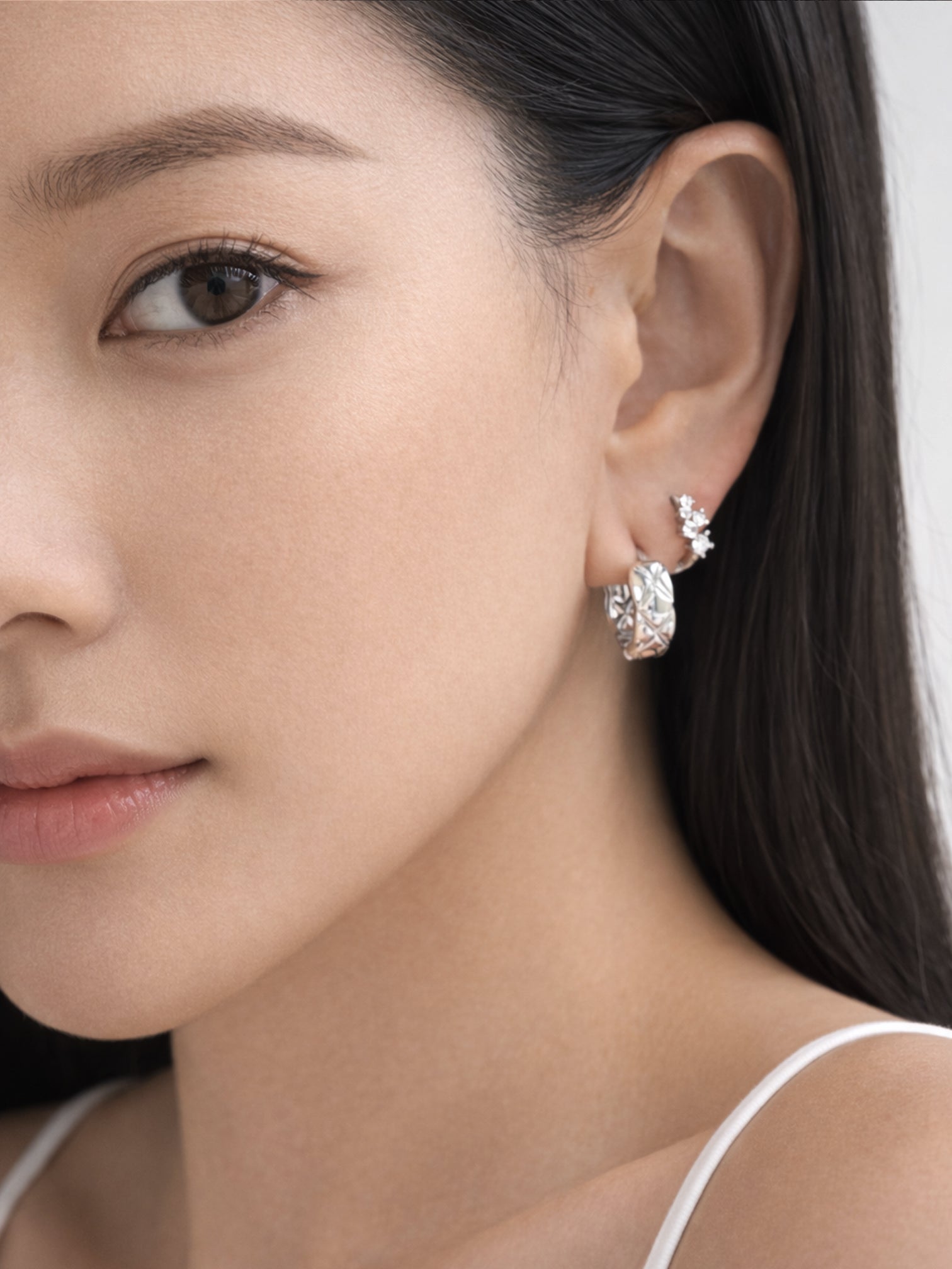 Model styled with myEdzy Coco Quilted Hoops showing elegant and modern jewelry look