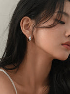 Silver chunky huggie hoop earrings thick mini hoops minimalist bold statement hypoallergenic everyday jewelry myEdzy side profile