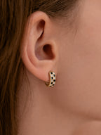 18k gold black white checker huggie hoop earrings enamel chunky mini hoops bold minimalist statement jewelry myEdzy close up ear