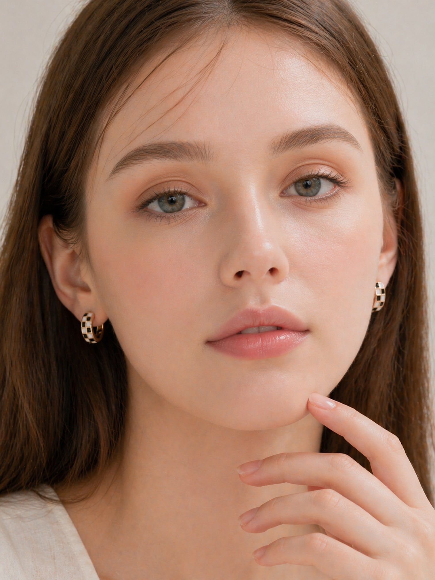 18k gold checker huggie hoop earrings black white enamel chunky mini hoops bold minimalist statement jewelry myEdzy model portrait
