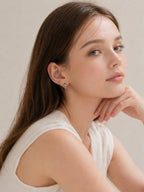 18k gold checker huggie hoop earrings black white enamel chunky mini hoops bold minimalist statement jewelry myEdzy lifestyle portrait
