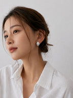 Brushed dome hoop earrings chunky minimalist huggie style bold statement hypoallergenic everyday jewelry myEdzy model portrait