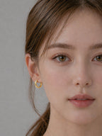 18k gold chunky huggie hoop earrings geometric faceted minimalist bold everyday jewelry hypoallergenic myEdzy front close up