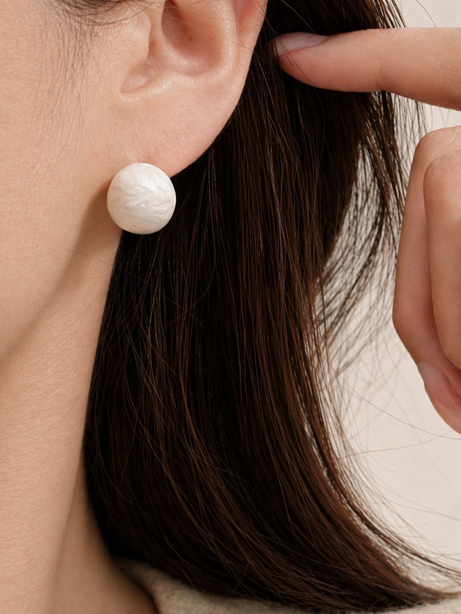 Bold marble stud earrings worn on ear gold resin statement earrings modern fashion jewelry by myEdzy