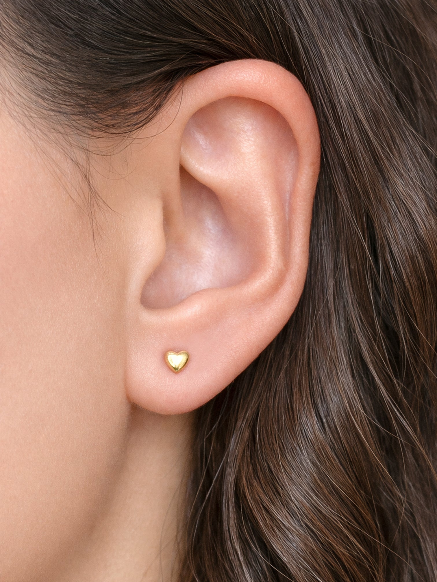 Ailo 4.4mm gold mini heart screw back earrings worn on ear waterproof hypoallergenic titanium steel studs by myEdzy