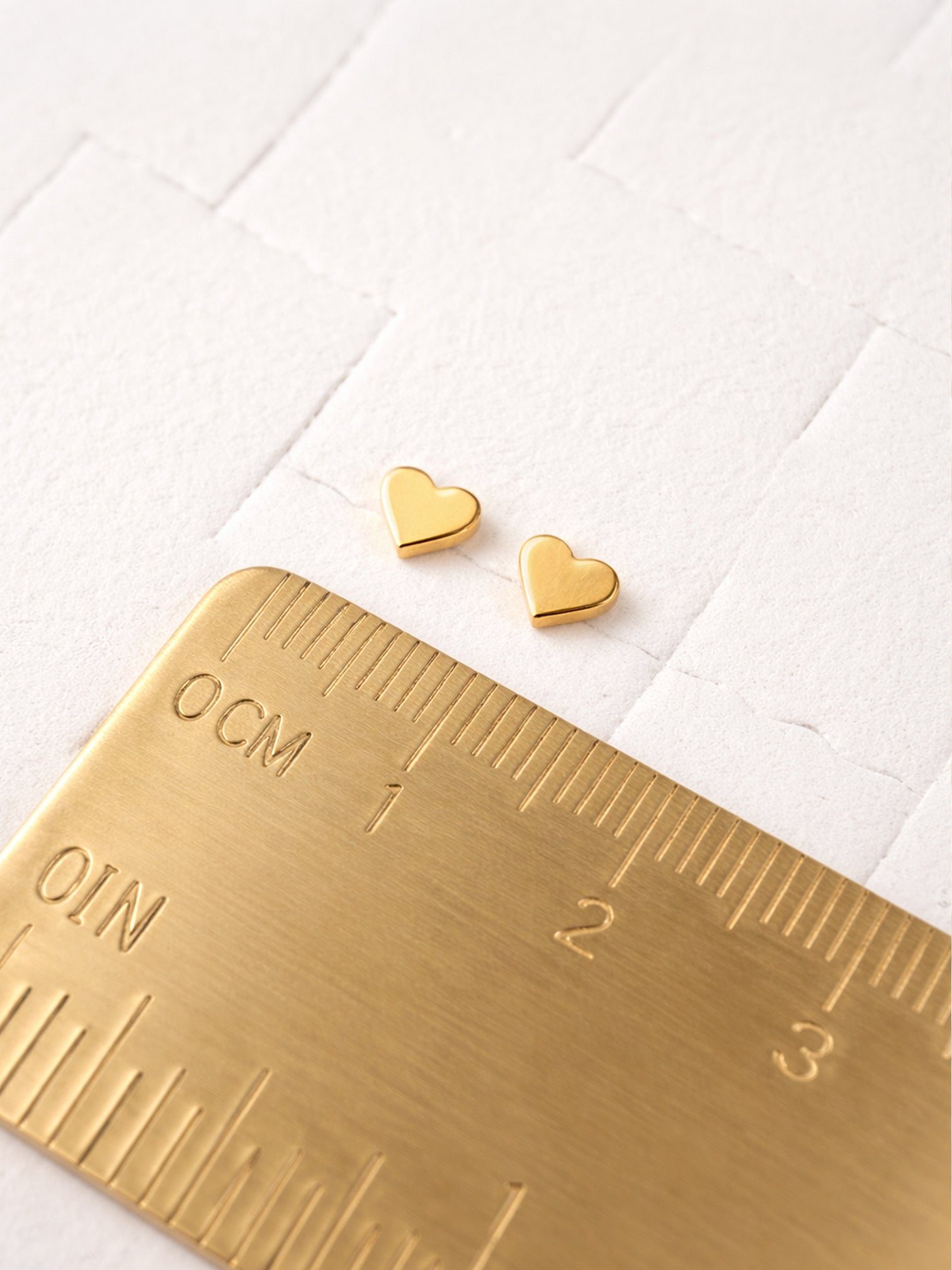 Ailo 18K gold plated mini heart stud earrings size reference small dainty heart earrings screw back flat back hypoallergenic by myEdzy