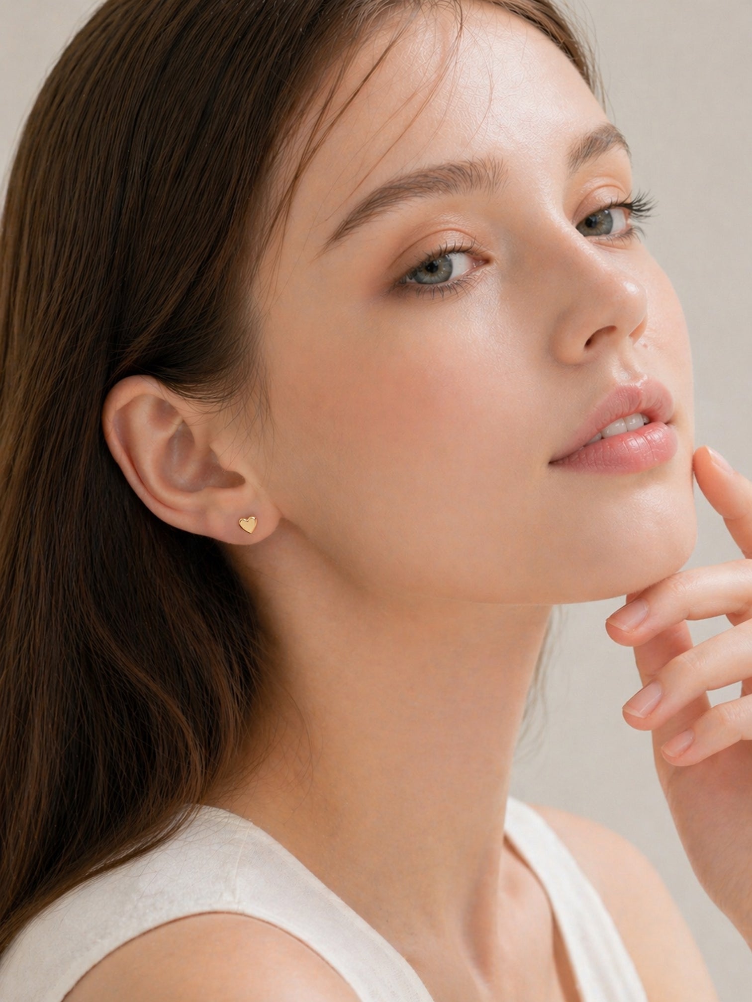18k gold mini heart stud earrings dainty minimalist hypoallergenic waterproof screwback everyday jewelry myEdzy side portrait