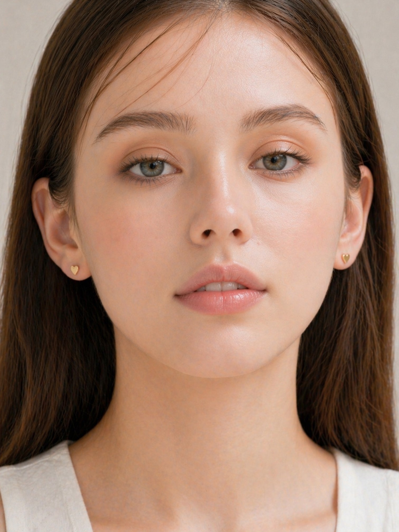 18k gold mini heart stud earrings dainty minimalist hypoallergenic waterproof screwback everyday jewelry myEdzy front portrait