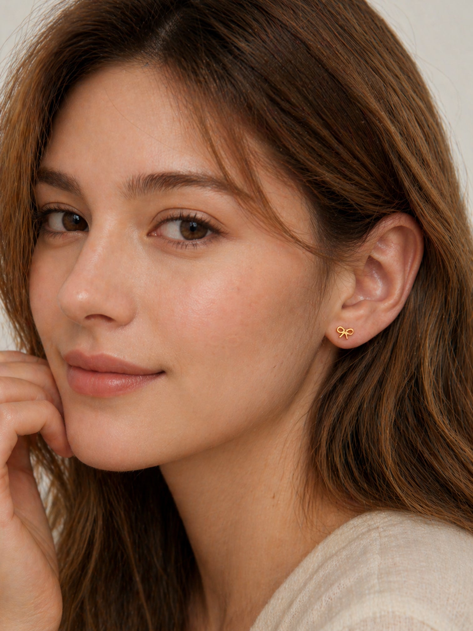 18k gold minimal bow stud earrings dainty ribbon design hypoallergenic waterproof screwback tarnish resistant everyday jewelry myEdzy side portrait