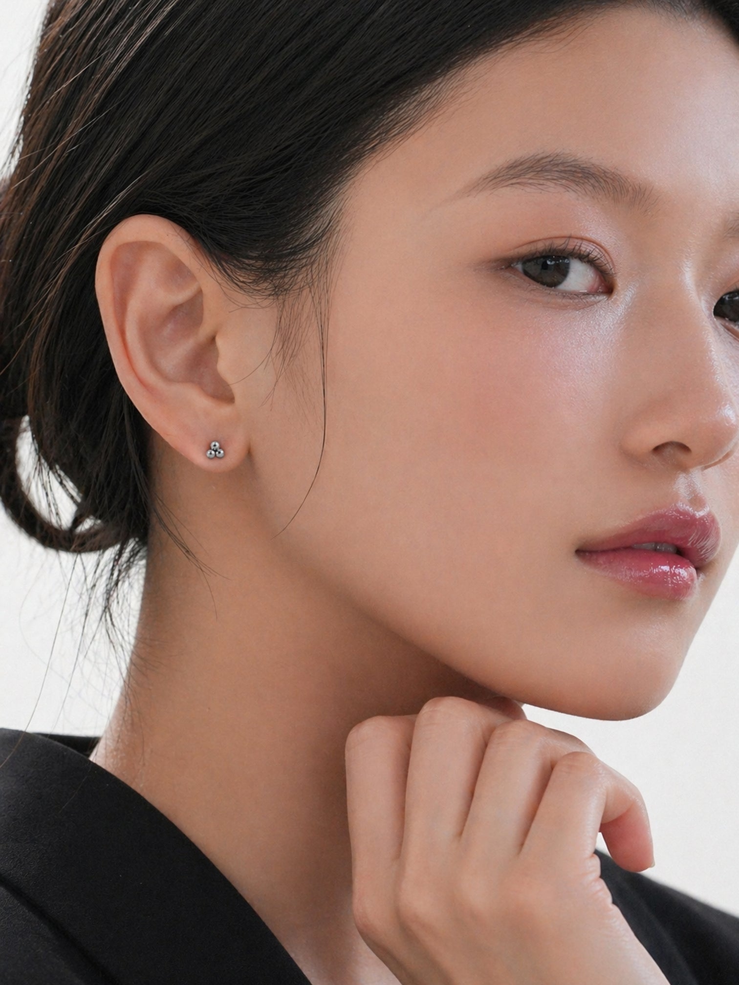 18k gold plated screwback stud earrings tiny triple cluster dainty minimalist hypoallergenic earrings for sensitive ears everyday jewelry myEdzy close up model portrait | myEdzy
