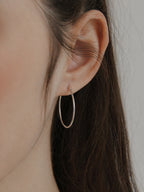 18k gold plated thin hoop earrings minimalist classic hoops lightweight hypoallergenic waterproof tarnish resistant everyday jewelry myEdzy close up ear