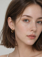 18k gold heart hoop earrings minimalist bold statement love design hypoallergenic waterproof tarnish resistant everyday jewelry myEdzy model portrait