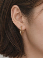 18k gold heart huggie hoop earrings close up polished finish minimal chic romantic style hypoallergenic waterproof tarnish resistant myEdzy detail shot