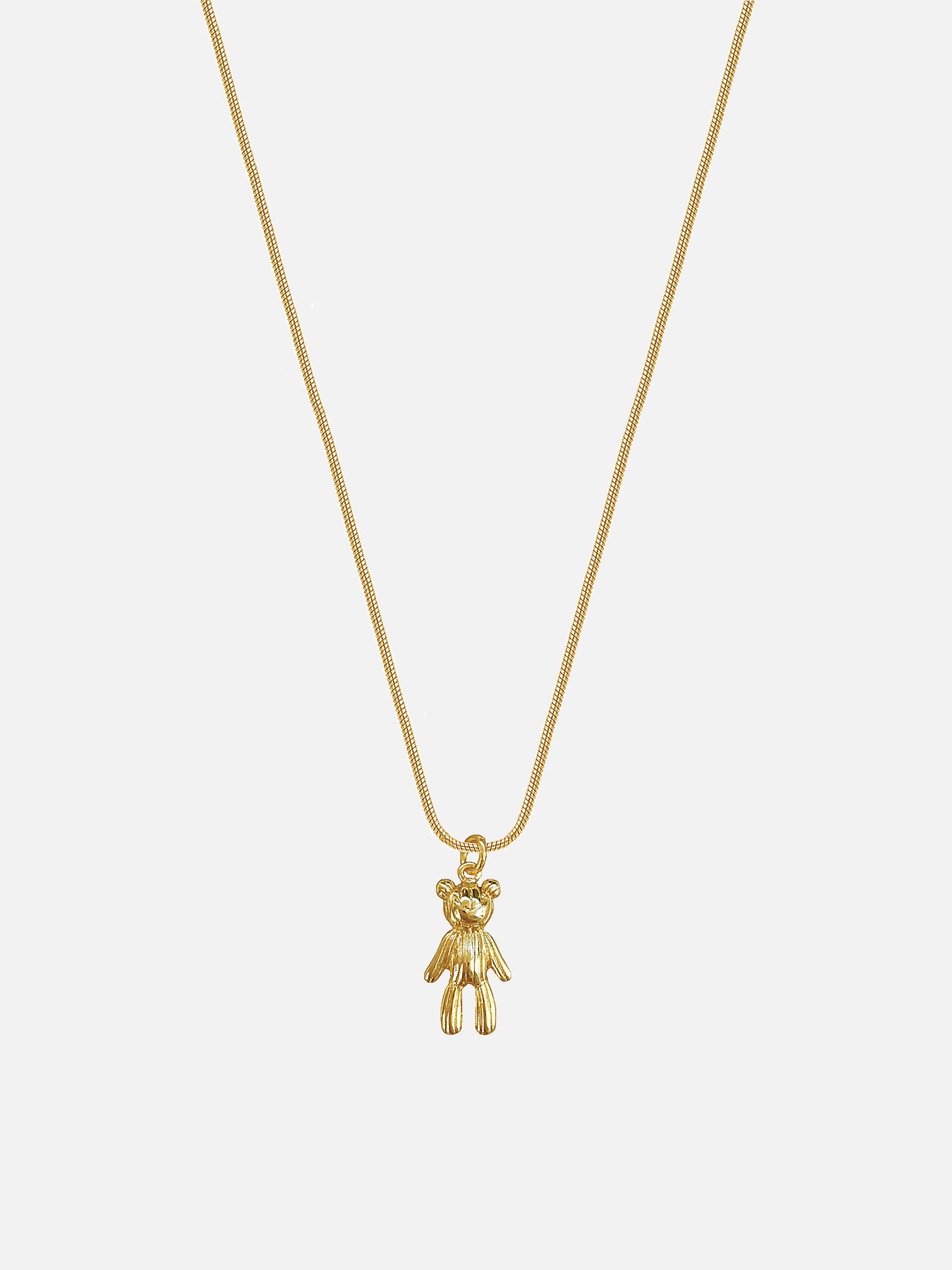 myEdzy Milo 18k gold teddy bear pendant necklace with delicate snake chain on a light background 