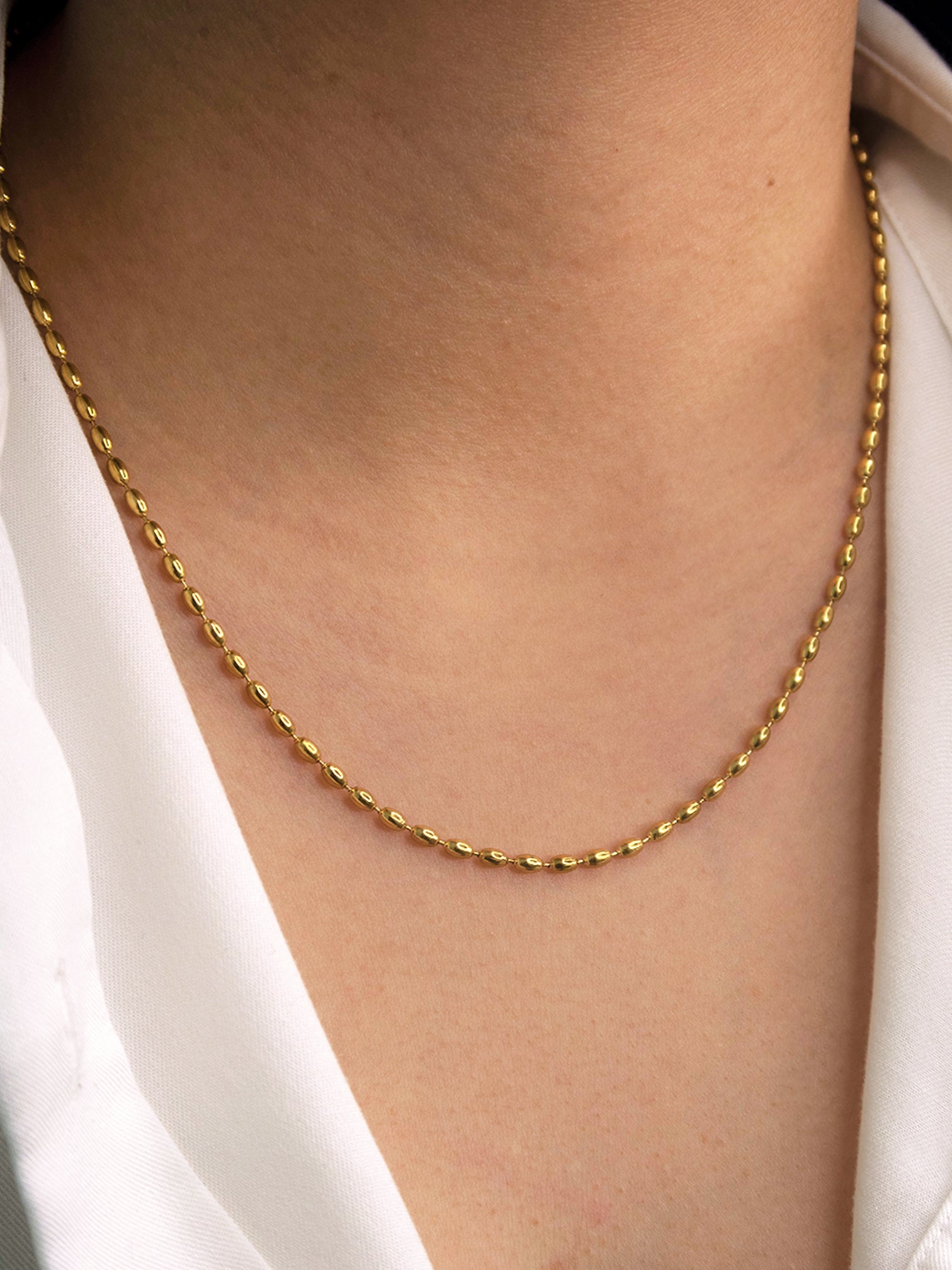 minimal gold bead chain necklace close up elegant everyday jewelry
