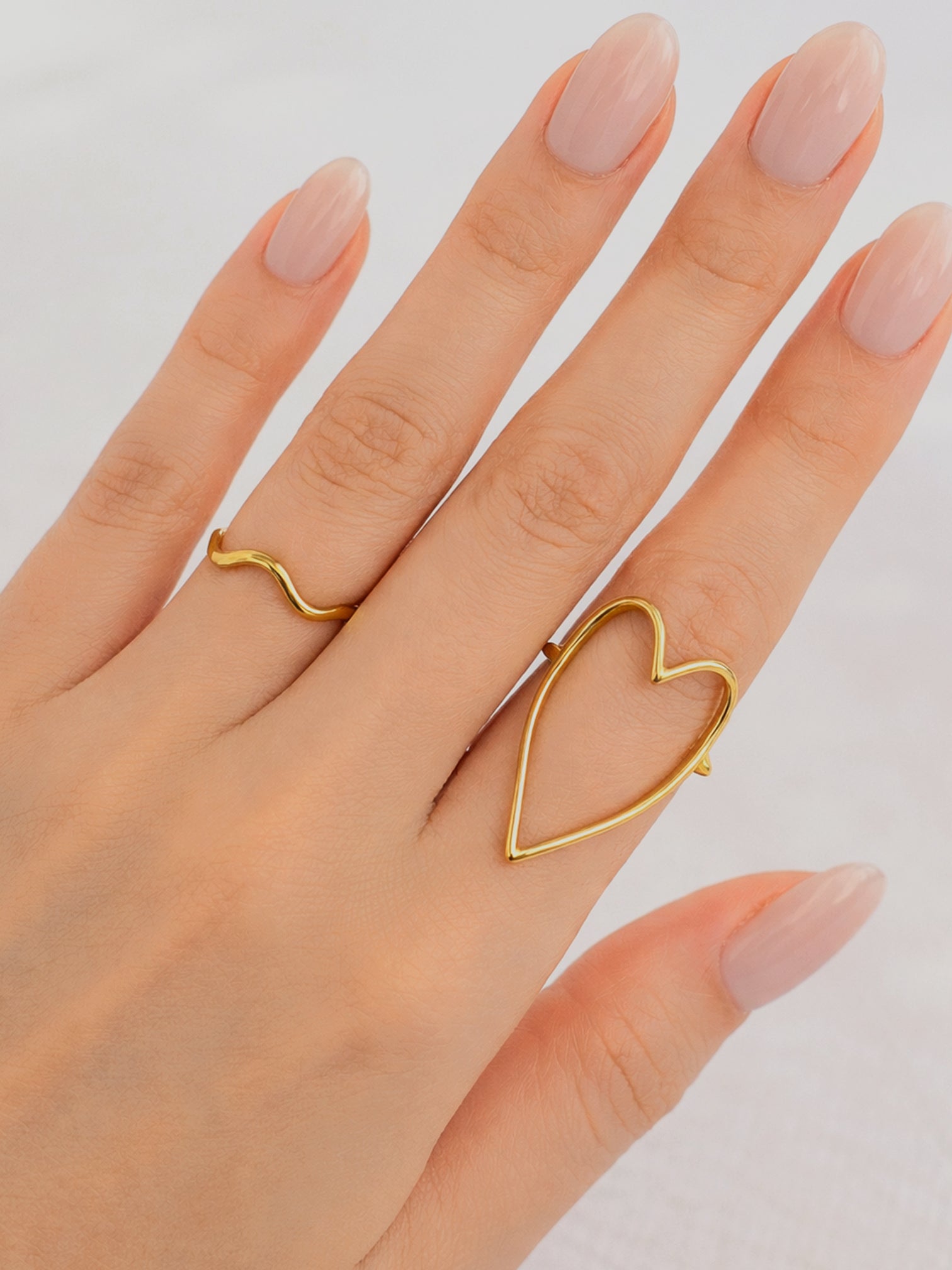 Linz gold heart shape ring worn on hand bold minimalist statement jewelry waterproof | myEdzy