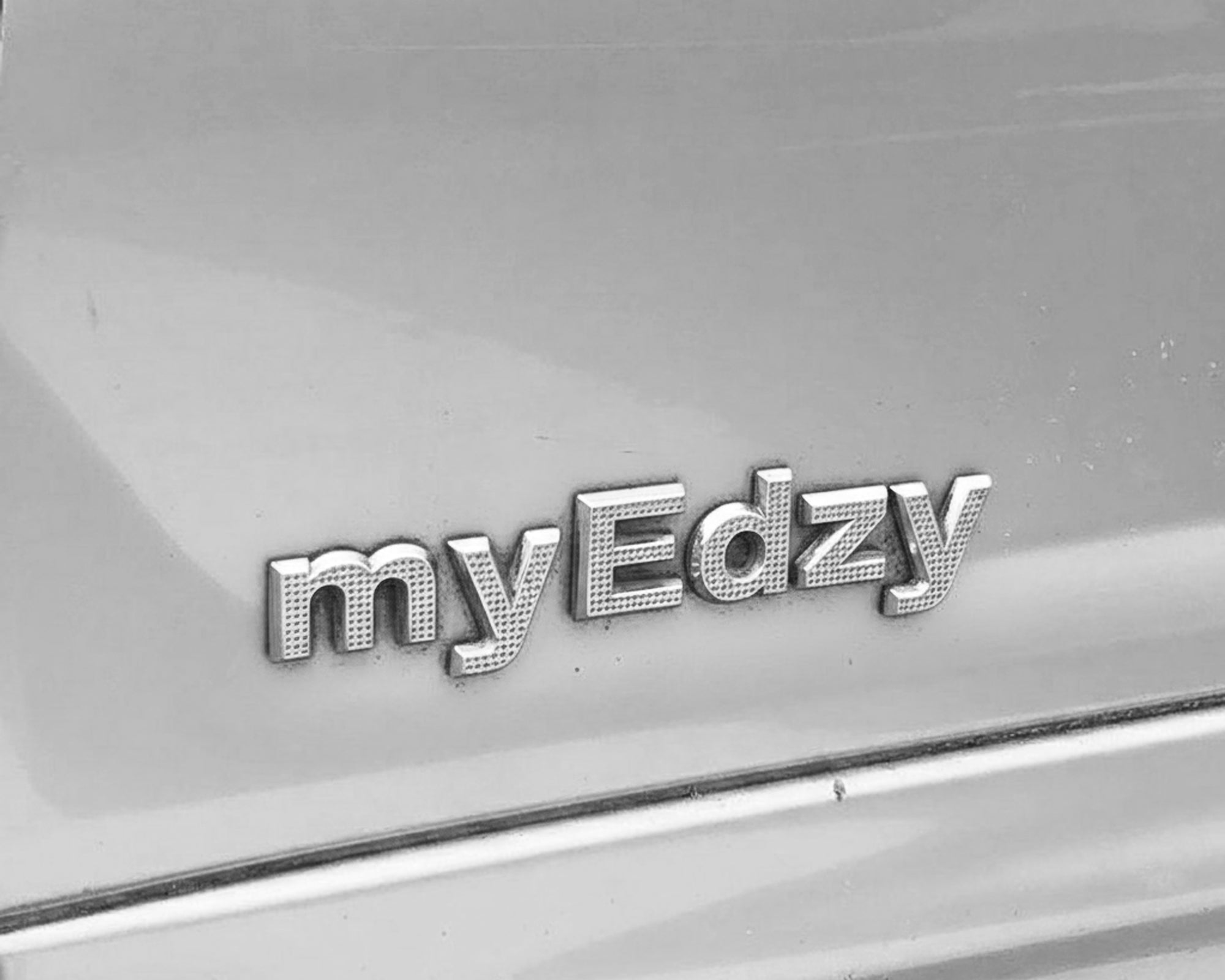 Close-up of the myEdzy logo symbolizing a modern Las Vegas jewelry brand built on real life, resilience, and personal stories